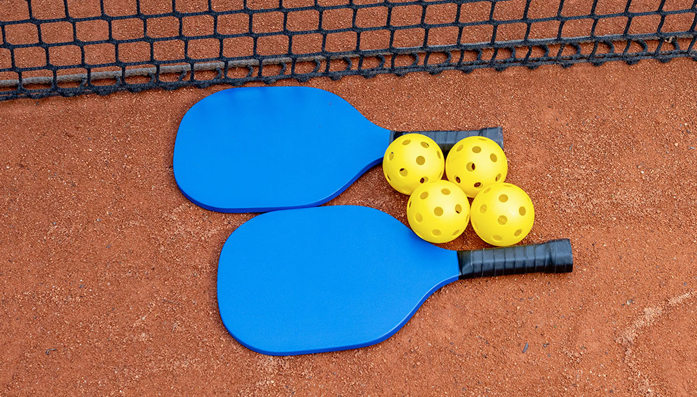 Pickleball paddle with balls