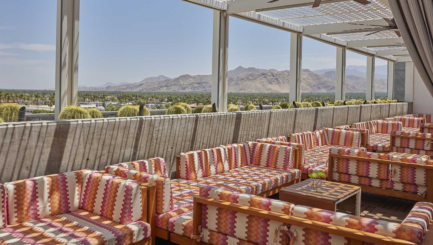 Poolside seating area overlooking mountainside