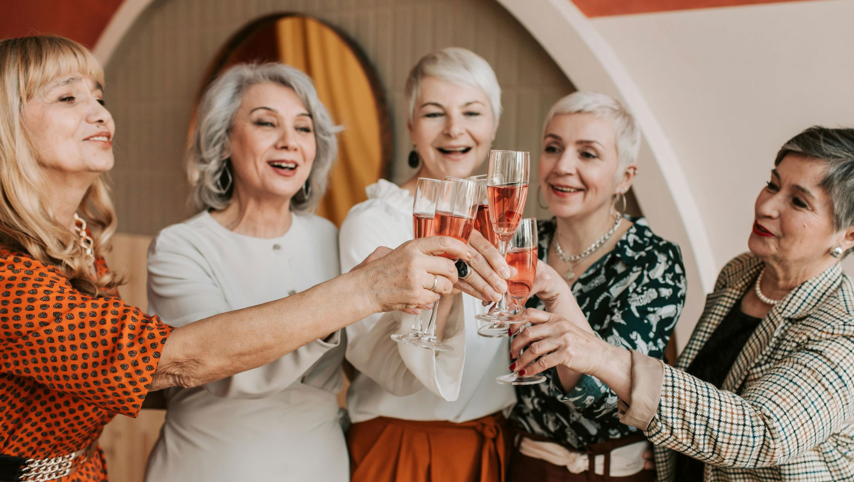 4 woman cheersing