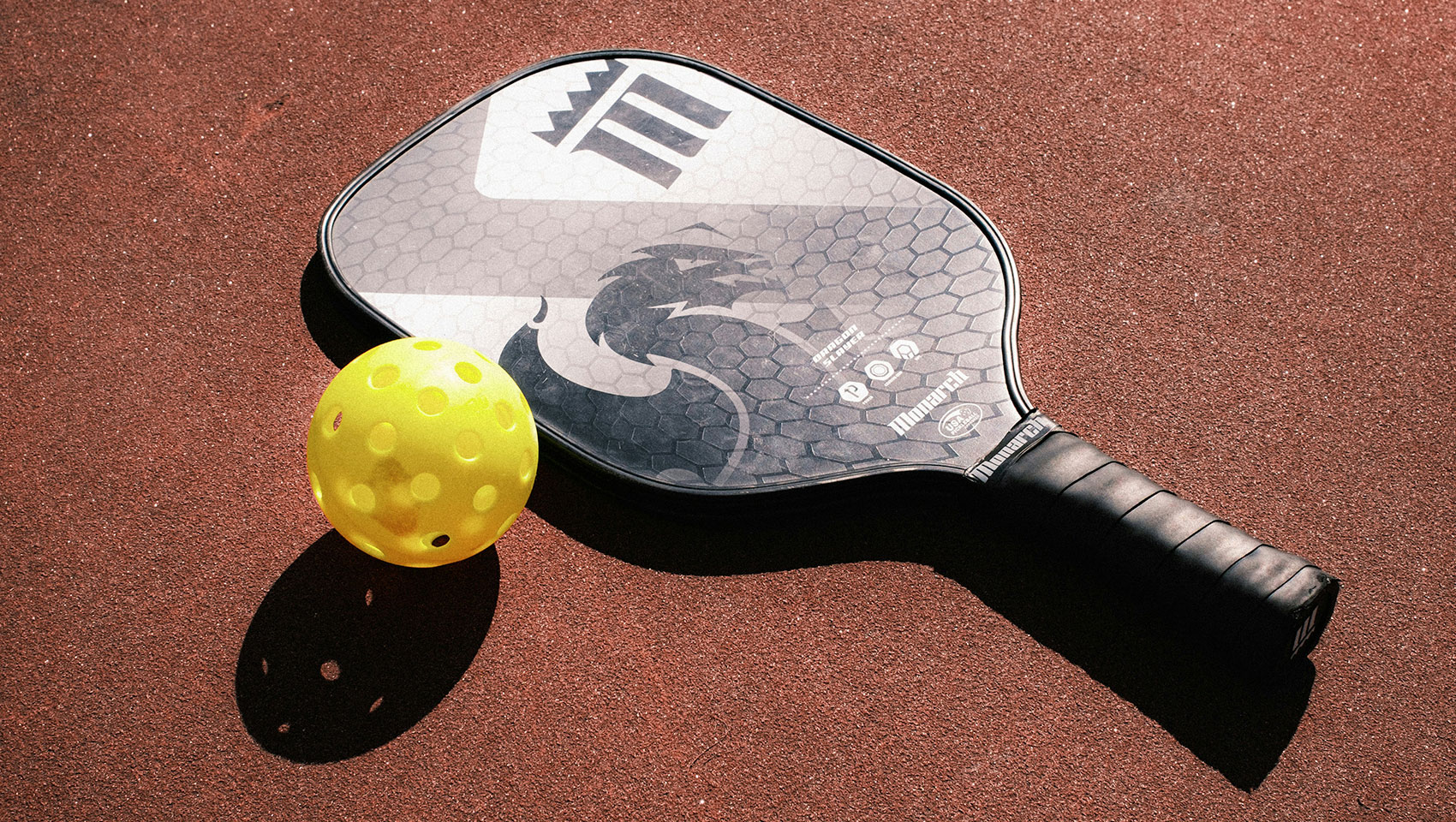 Pickleball racquet with ball